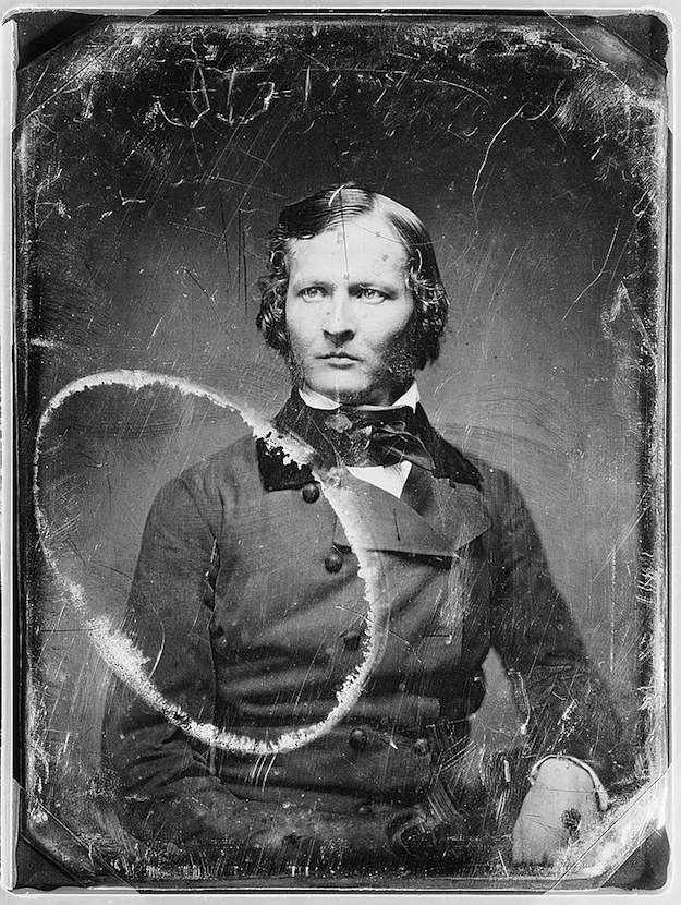 Daguerreotype portrait of a man in a suit, seated