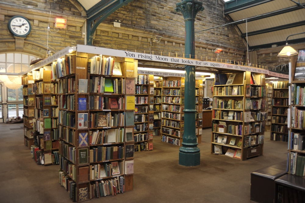 stacks of bookshelves in an airy brick building