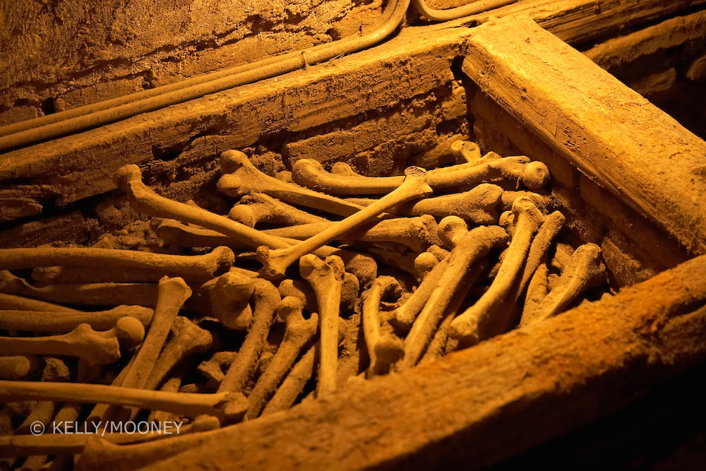 Human bones lay in a wooden chest