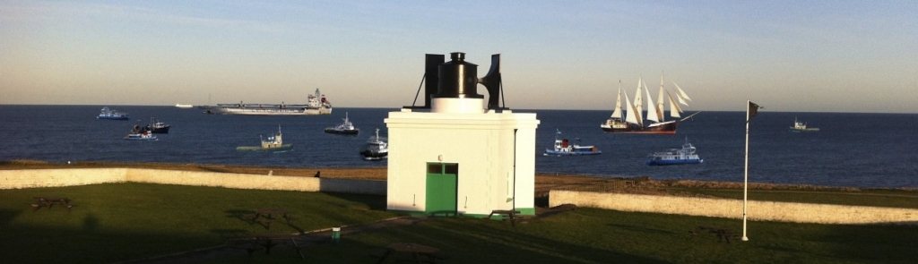 Fog Horn with boats at sea in background