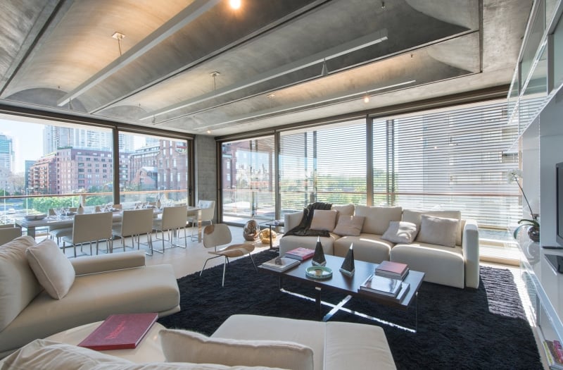 Living room with large glass windows and ample seating