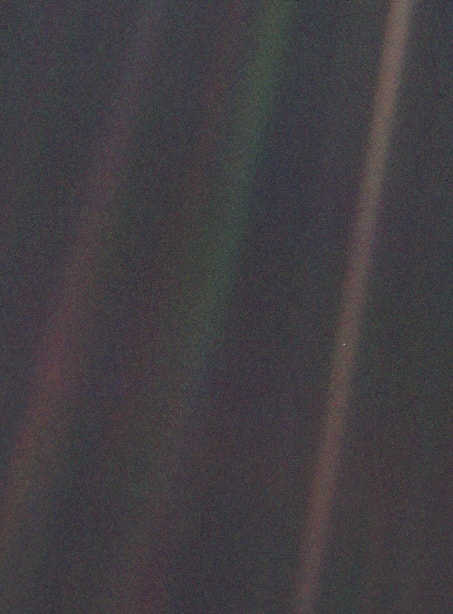 A photograph of the earth taken from Voyager 1. 