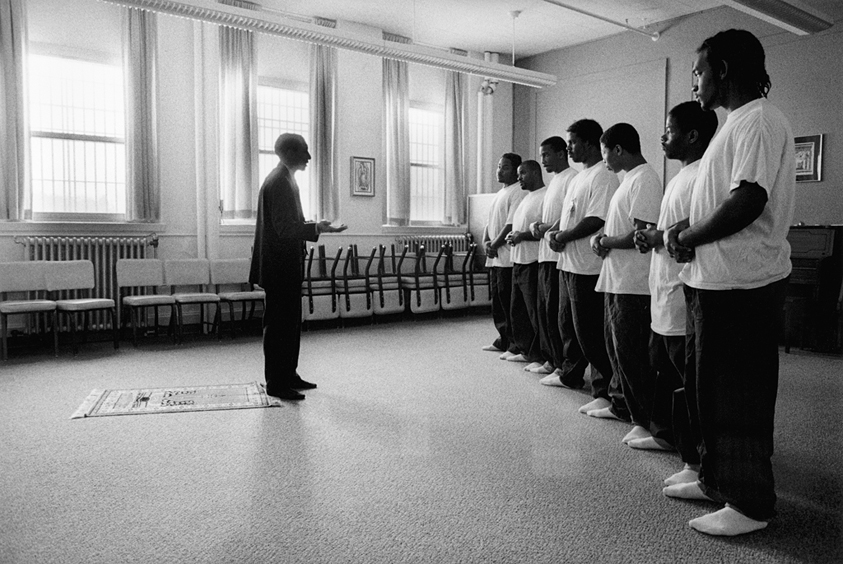 Men praying in prison