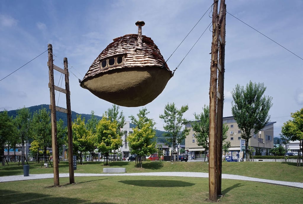 Mini-home suspended above park 