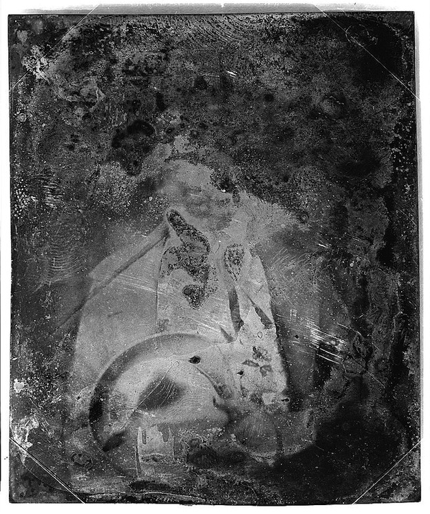 Daguerreotype portrait of a man holding his hat