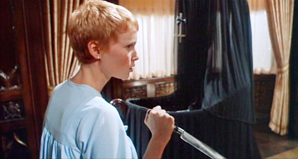 Mia Farrow holds a knife in film Rosemary's Baby.