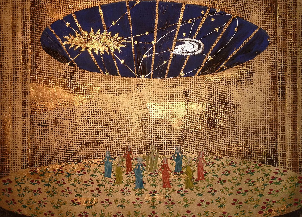 The start of a tapestry in creation showing a sun and a moon