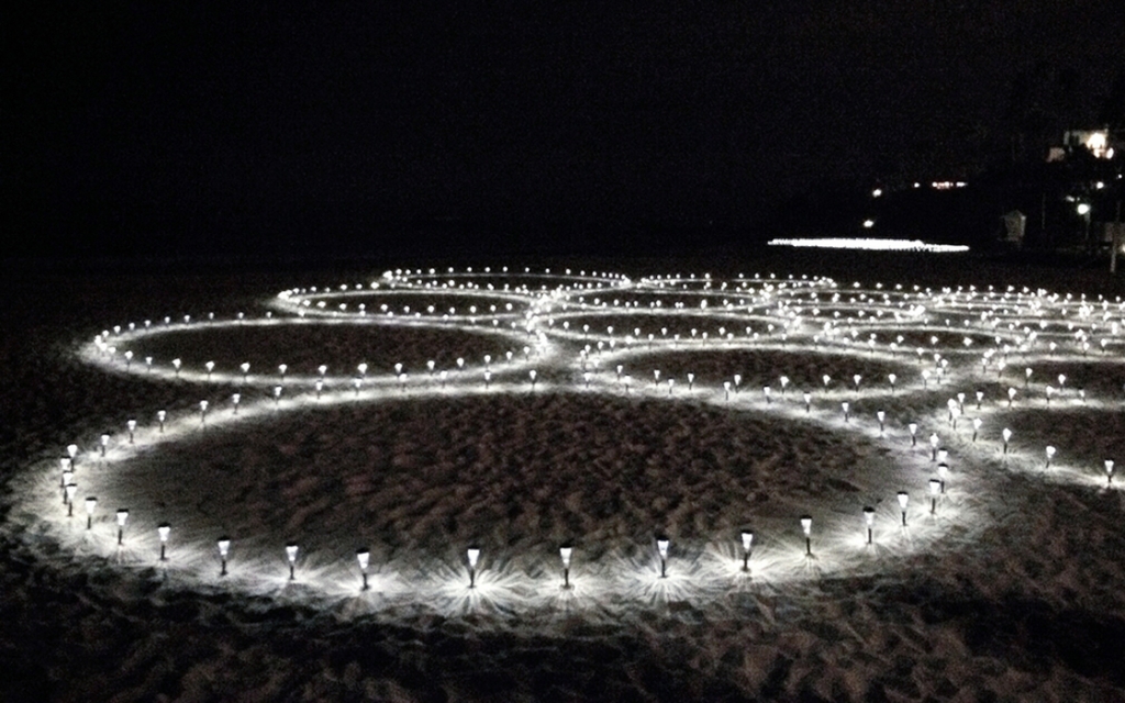Solar lights on beach in the dark