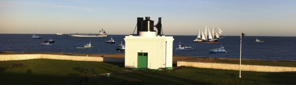 Fog Horn with boats at sea in background