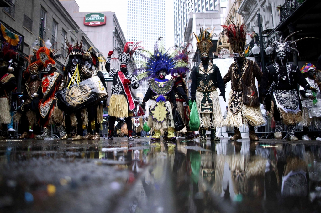 people in costume and masks for mardi gras in new orleans