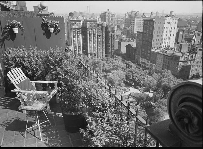 Black and white photo of a penthouse balcony. 