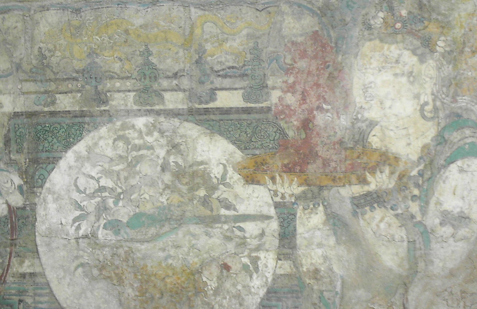 an old wall fresco of an individual carrying a bonzi tree