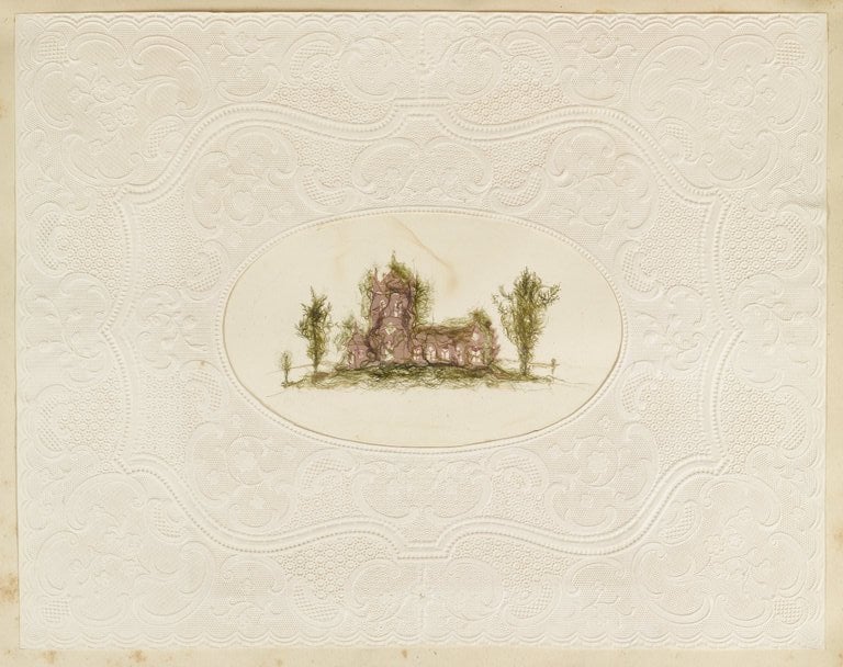 Dried seaweed in the shape of a manor house in an album