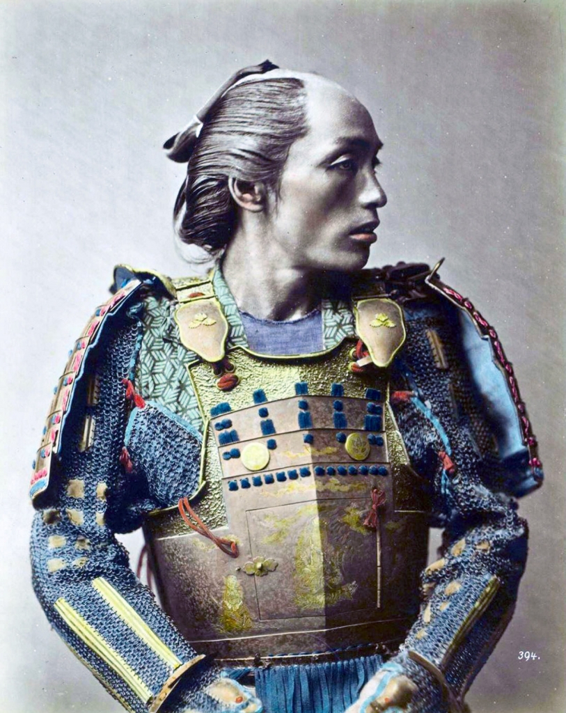 A hand-painted photograph of a samurai in armour 