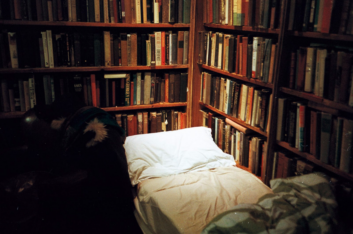 A bed set up in a library