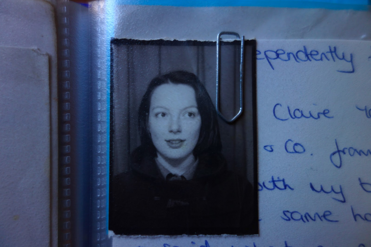 A photograph of a young lady in a scrapbook