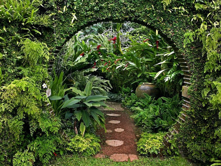 circular garden entrance covered in greenery