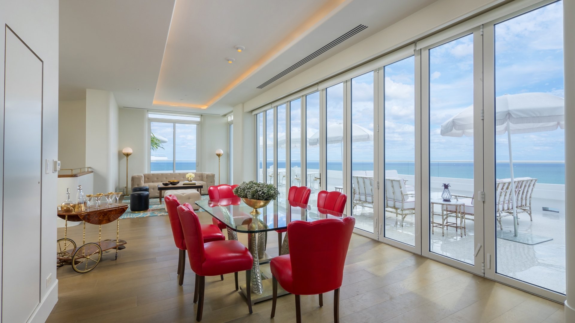 dining area in hotel penthouse with a wall of windows
