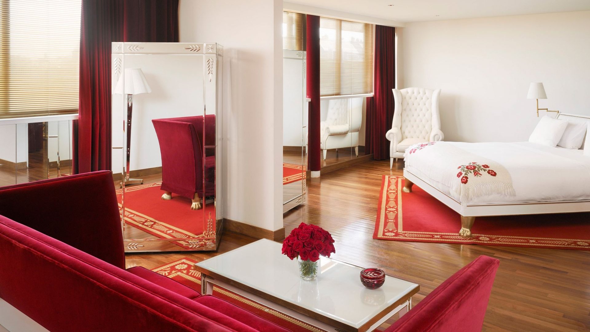 hotel suite with bed and seating area