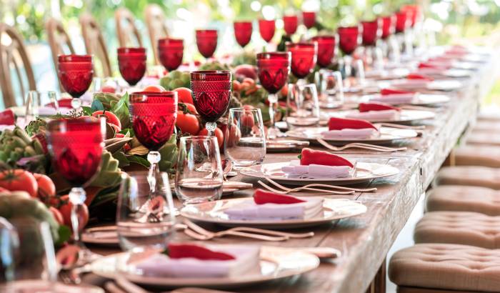 long table with place settings and wine glasses