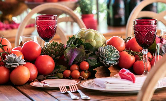table setting with tomatoes and artichokes