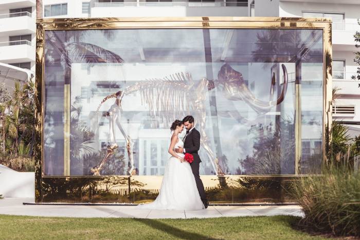 bride and groom outside pose together