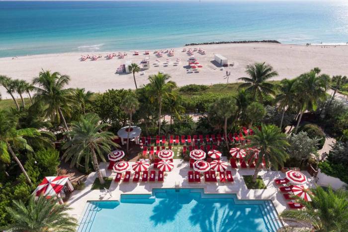 Aerial view of hotel pool on the edge of beach
