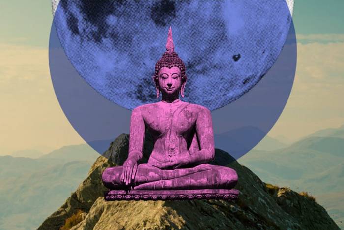 Pink buddha statue on abstract background
