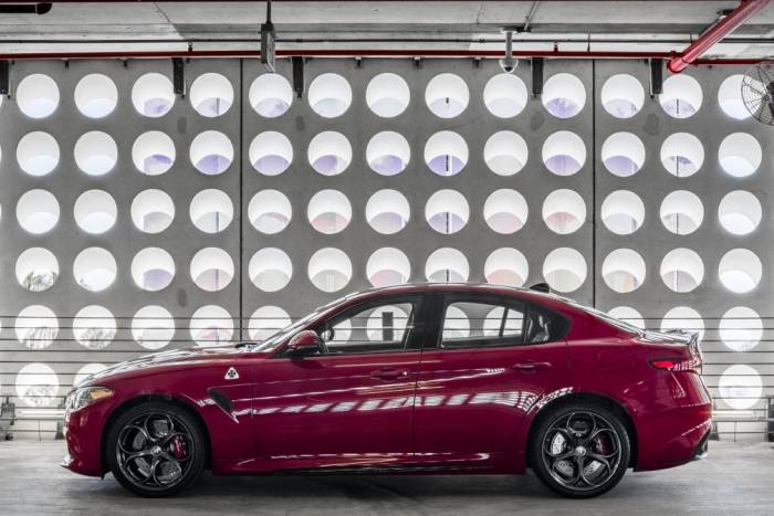 Red alfa romeo car in garage