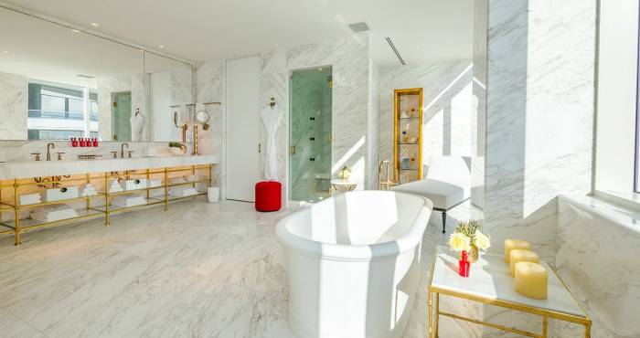 hotel bathroom with large stand alone bathtub
