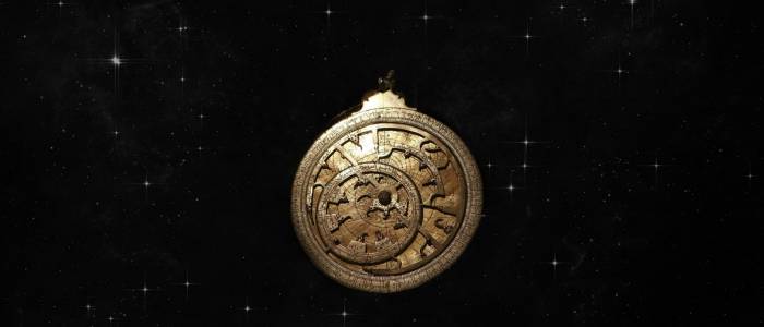 Astrolabe against background of stars 
