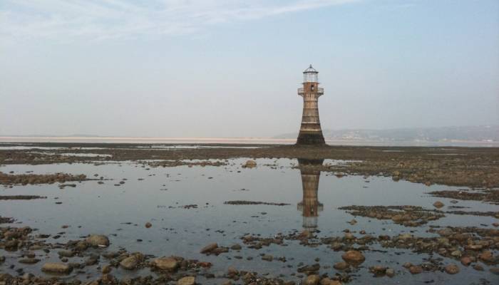 Whiteford beach lighthouse at dusk