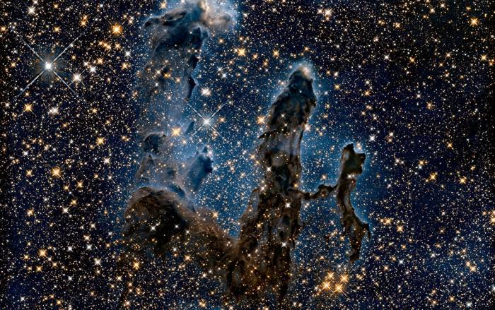 Pillars of creation surrounded by stars 