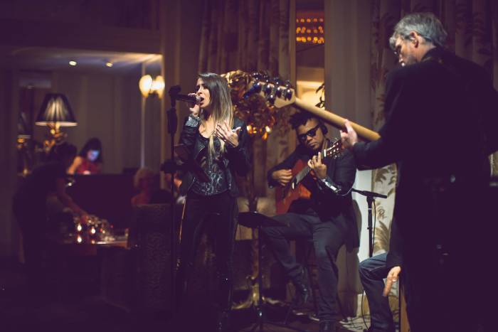 woman singing with a band