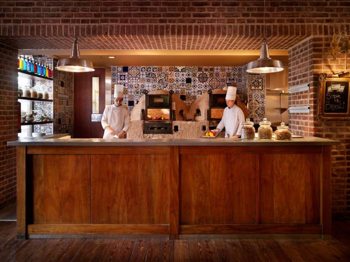 two chefs cook in kitchen