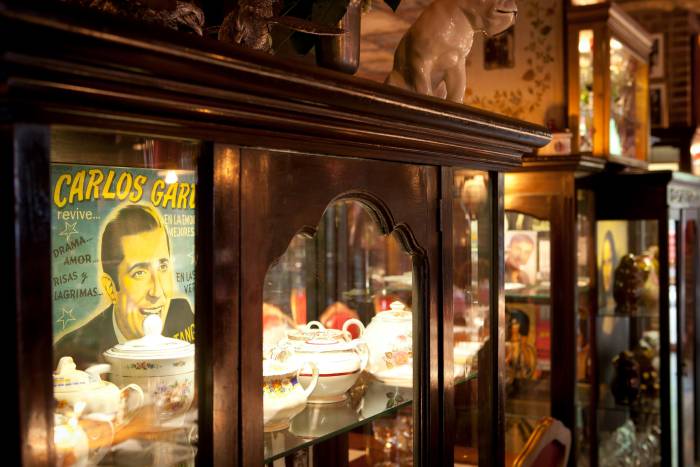interior shot of cabinet with shelves full of ornate dishware