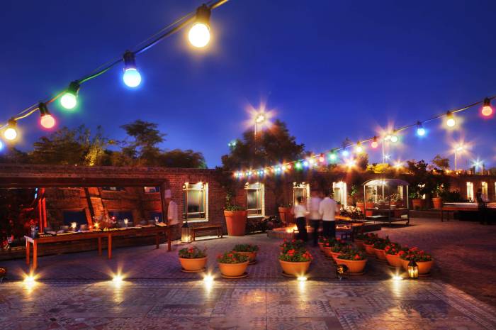 patio lit up by multicolored strings of lights