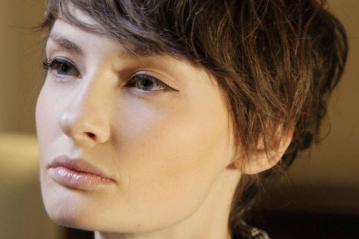 close up of a woman with a pixie cut