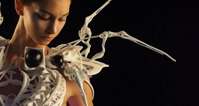 woman in a dress made from skeleton parts