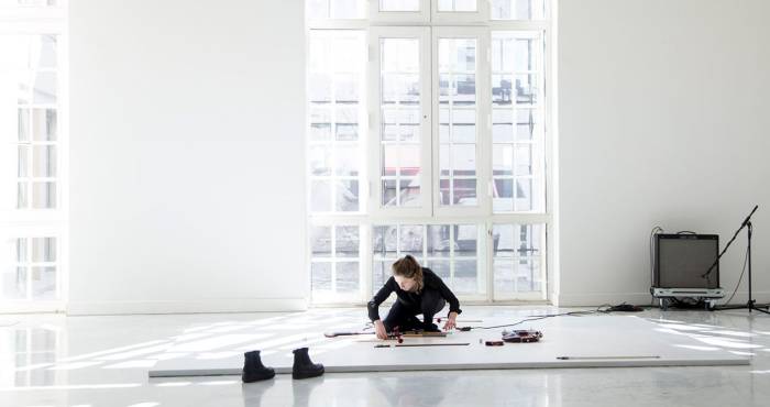 L Rain performing on Naama Tsabar's Melodies of Certain Damage