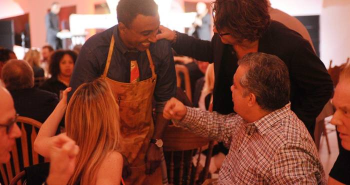 group of chefs and audience members chat amongst themselves