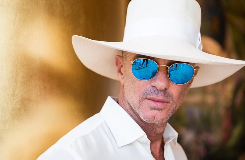 Alan Faena in a white hat and sun glasses