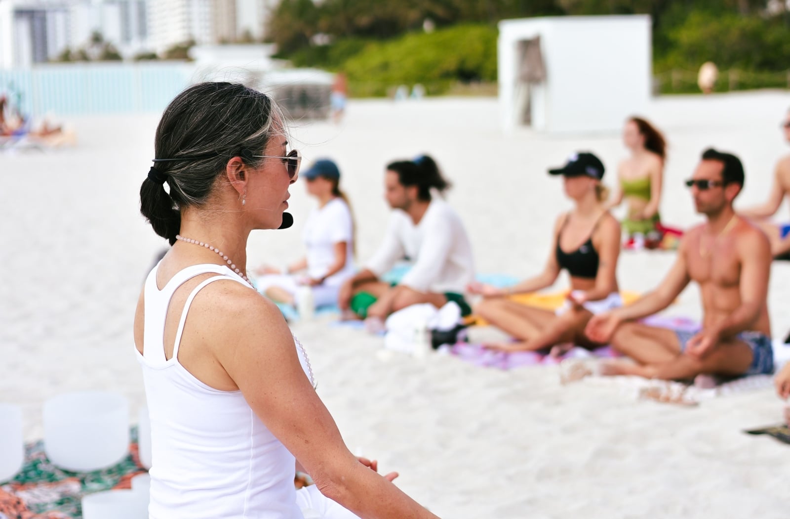 Agustina leading a yoga class on the beach