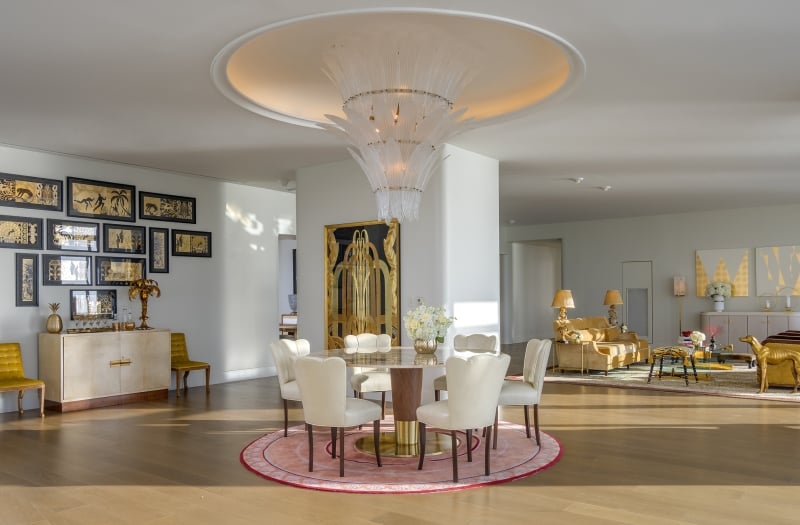 hotel penthouse open space with dining and living areas