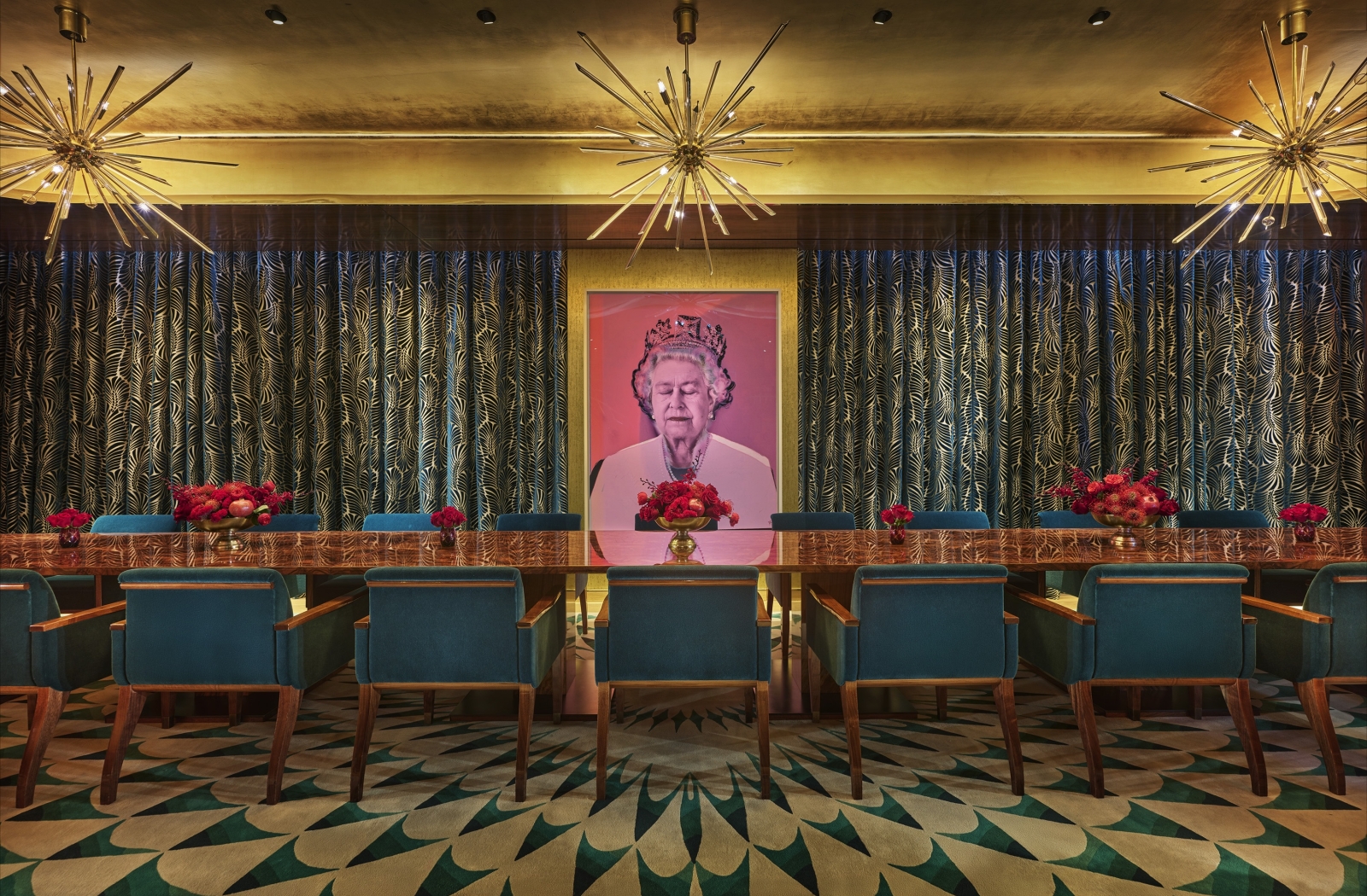 An eclectic private dining room with a long table and a pop art painting of Queen Elizabeth