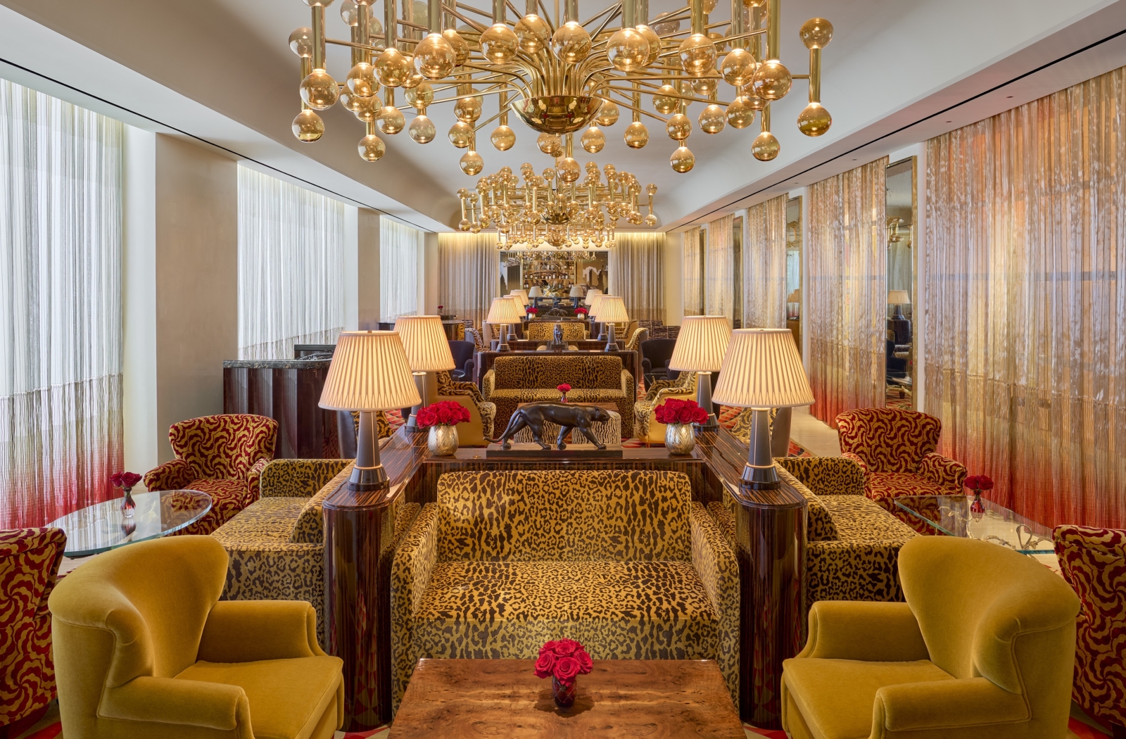 The Living Room, a stylish open bar with gold adornments, at Faena New York