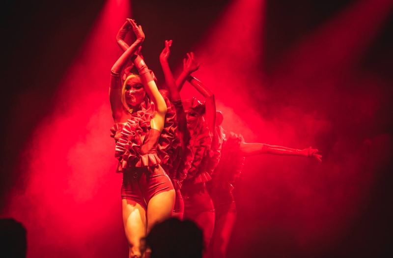 women in red dance in Tryst Cabaret