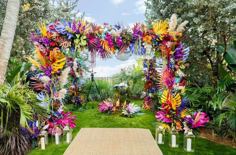 Alter archway made of colourful flowers