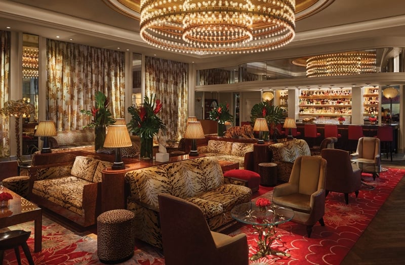 bar and lounge area filled with animal print couches
