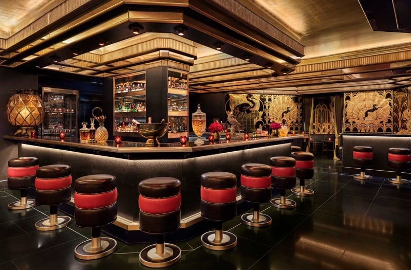 saxony bar interior with red and black stools at the bar